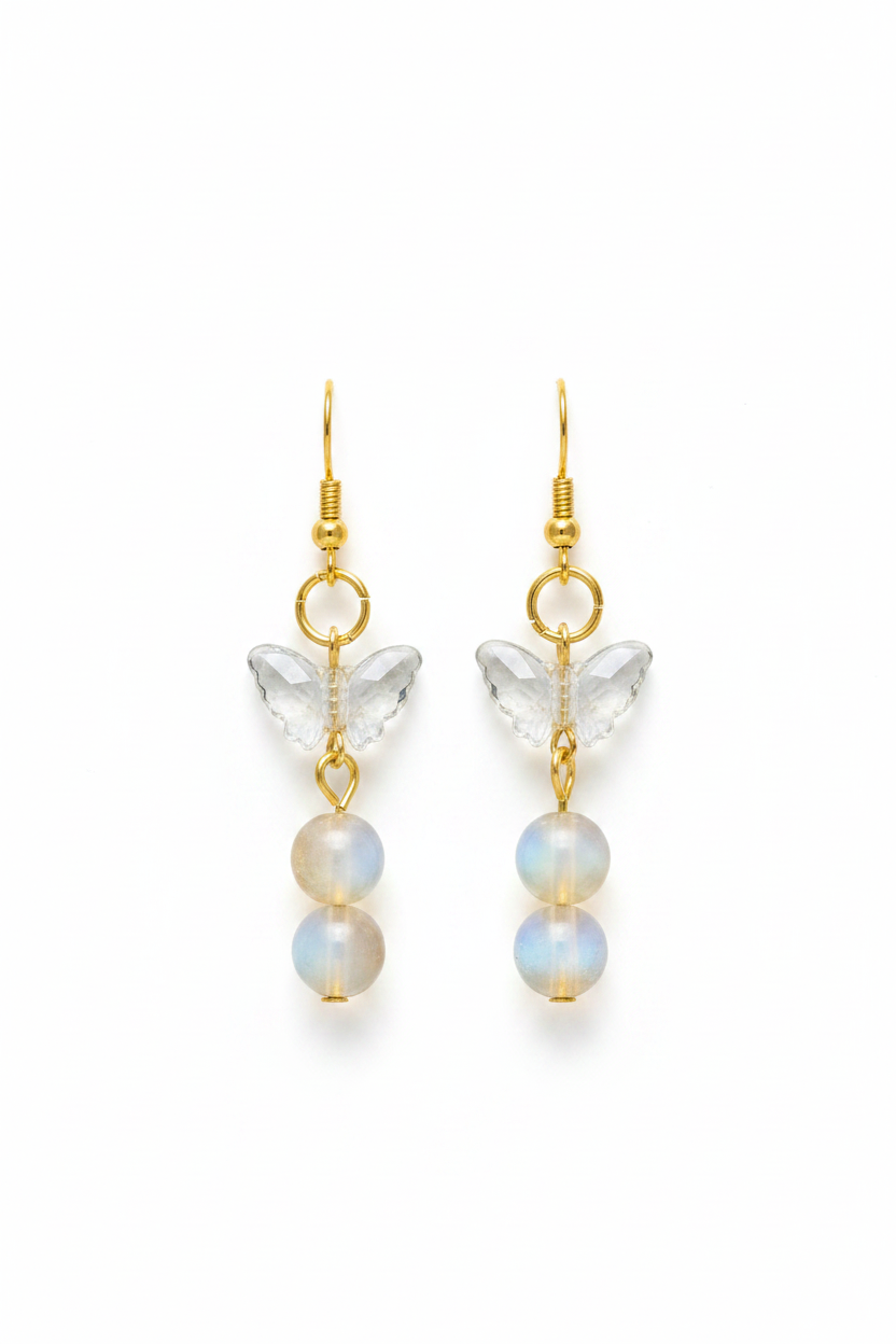Boucles papillon cristal perles nacre fond blanc