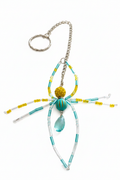 Porte-clés araignée turquoise jaune fond blanc